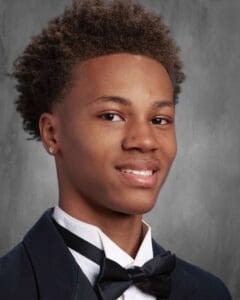 A young man in a suit and tie.