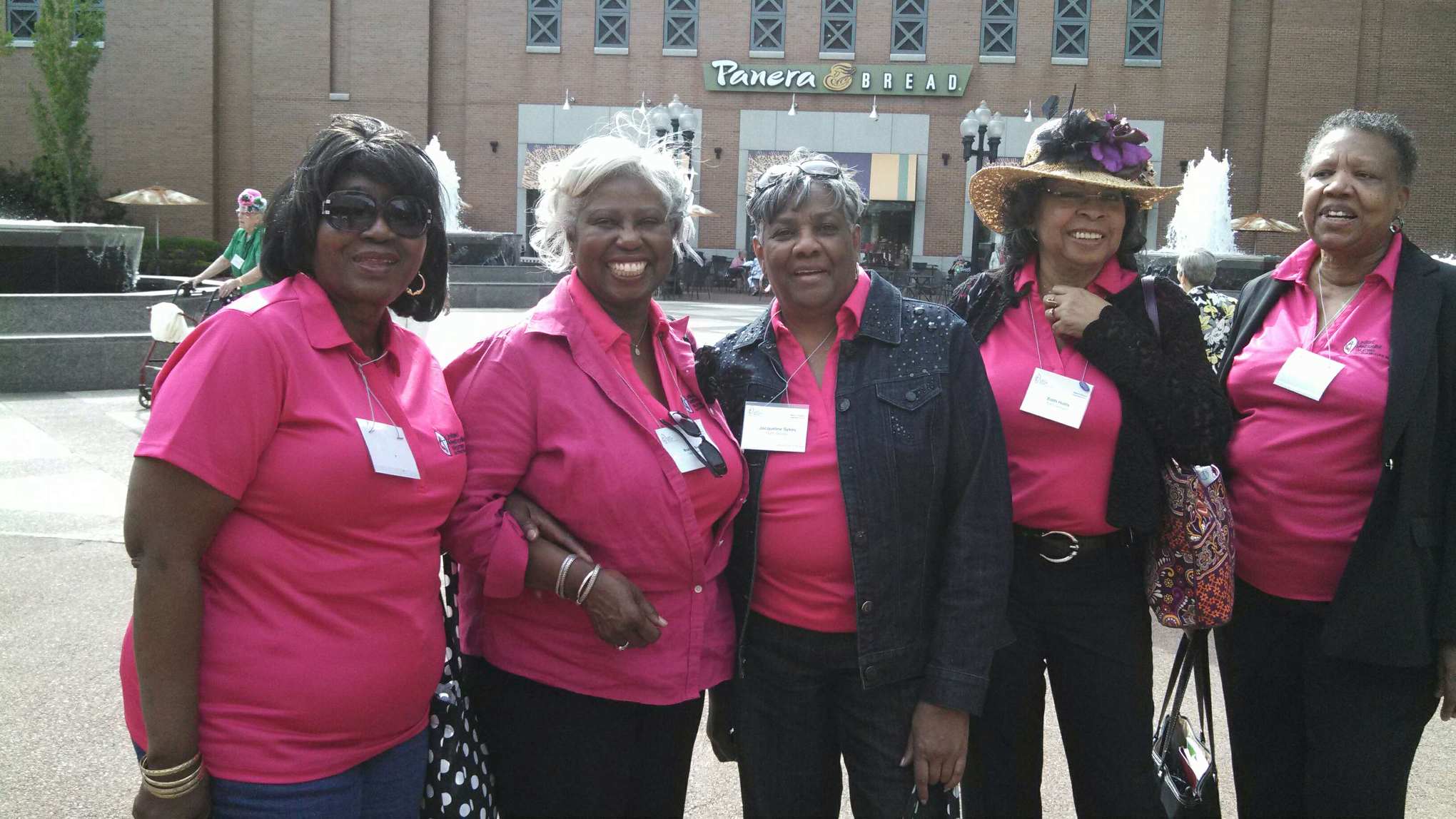 A group of women standing next to each other.