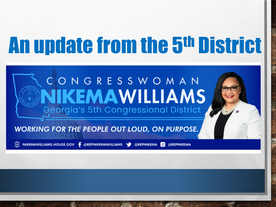 A sign with a picture of congresswoman nikema williams.