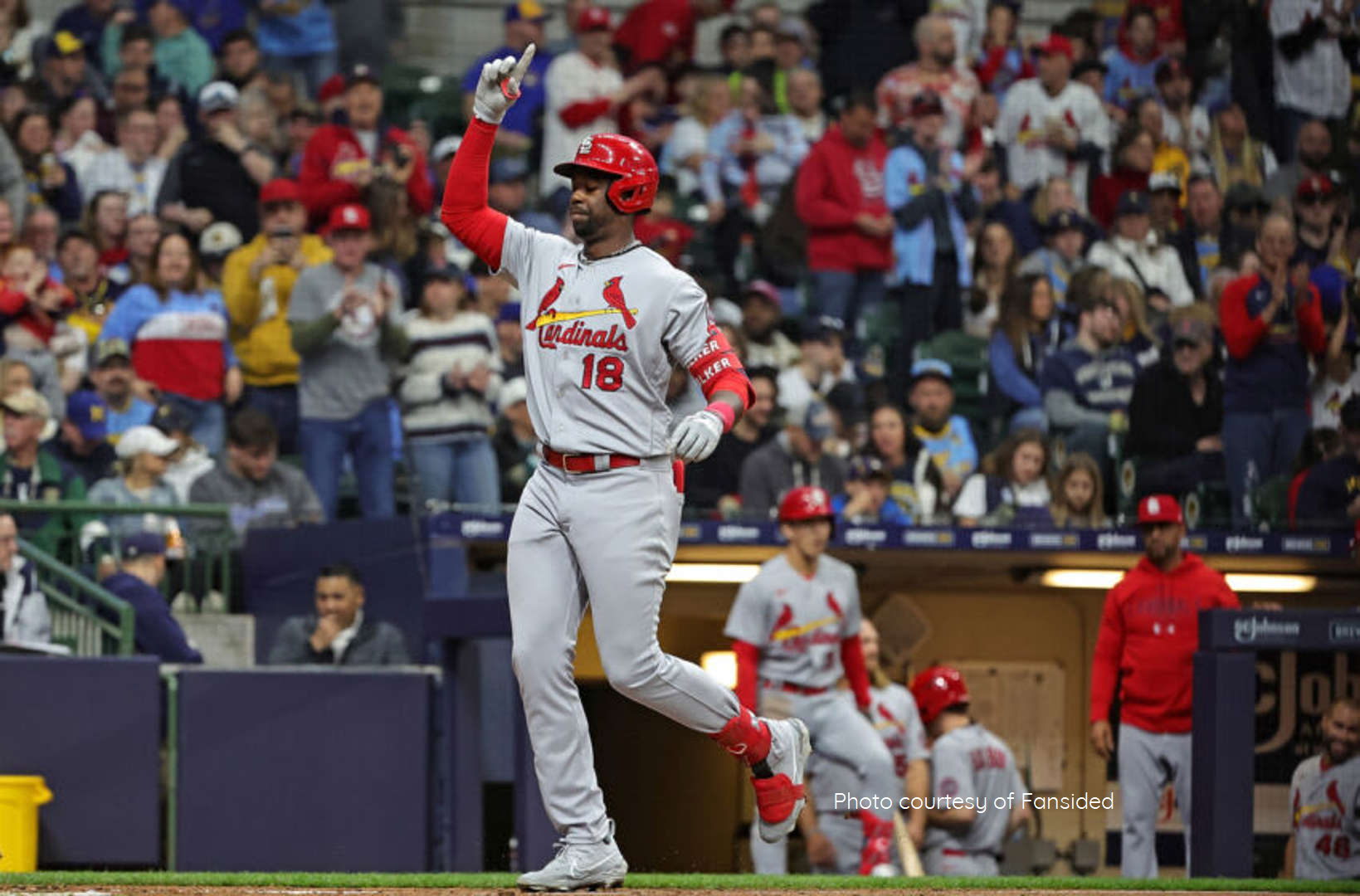 Jordan Walker Home Run Photo with caption A baseball player is running to the plate
