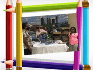 A group of people standing around a table.